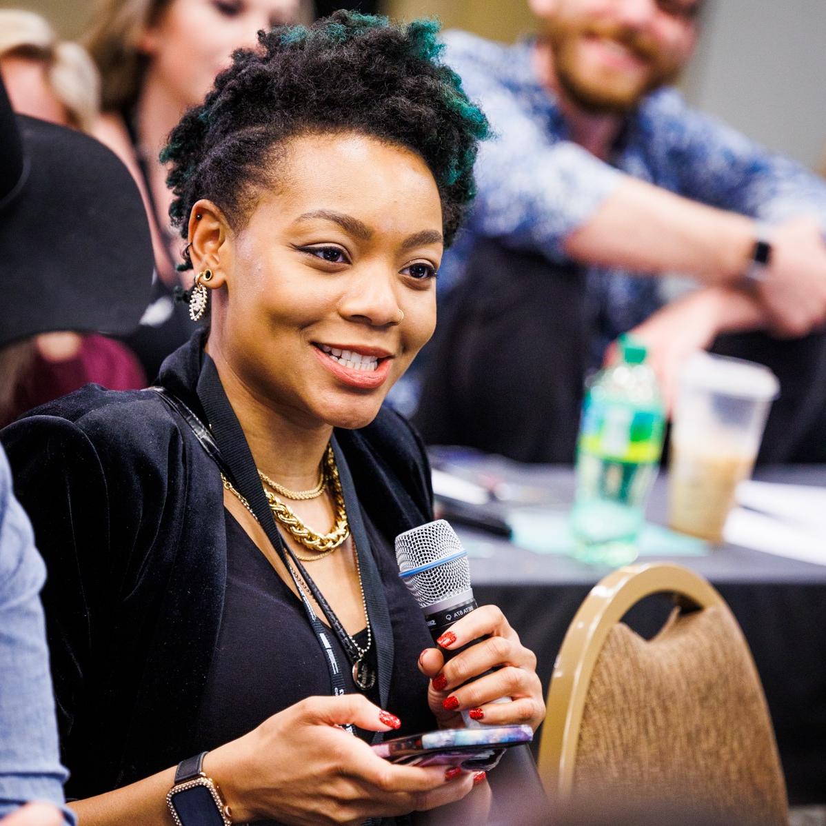 Image of woman holding a microphone